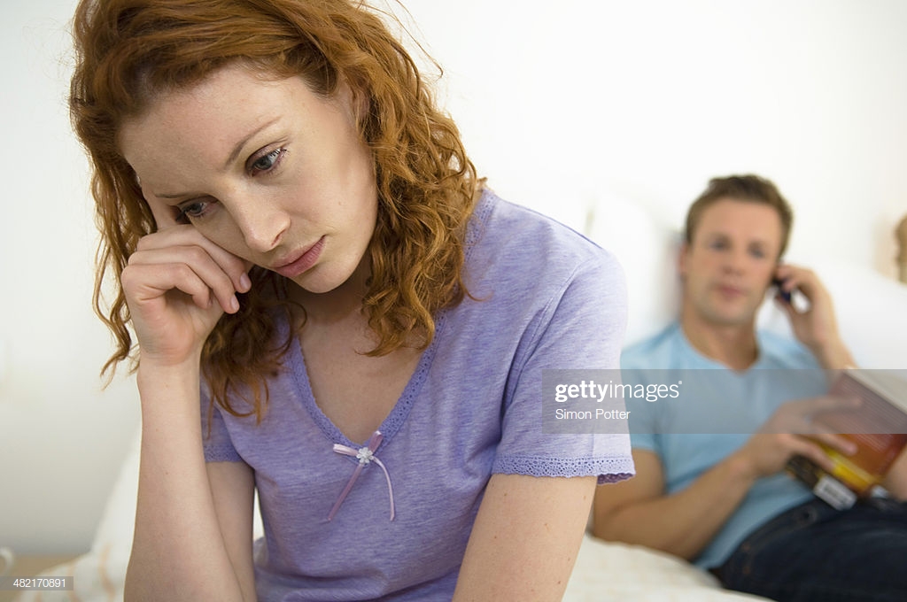 Troubled Woman Husband In Background Stock Photo Getty Image