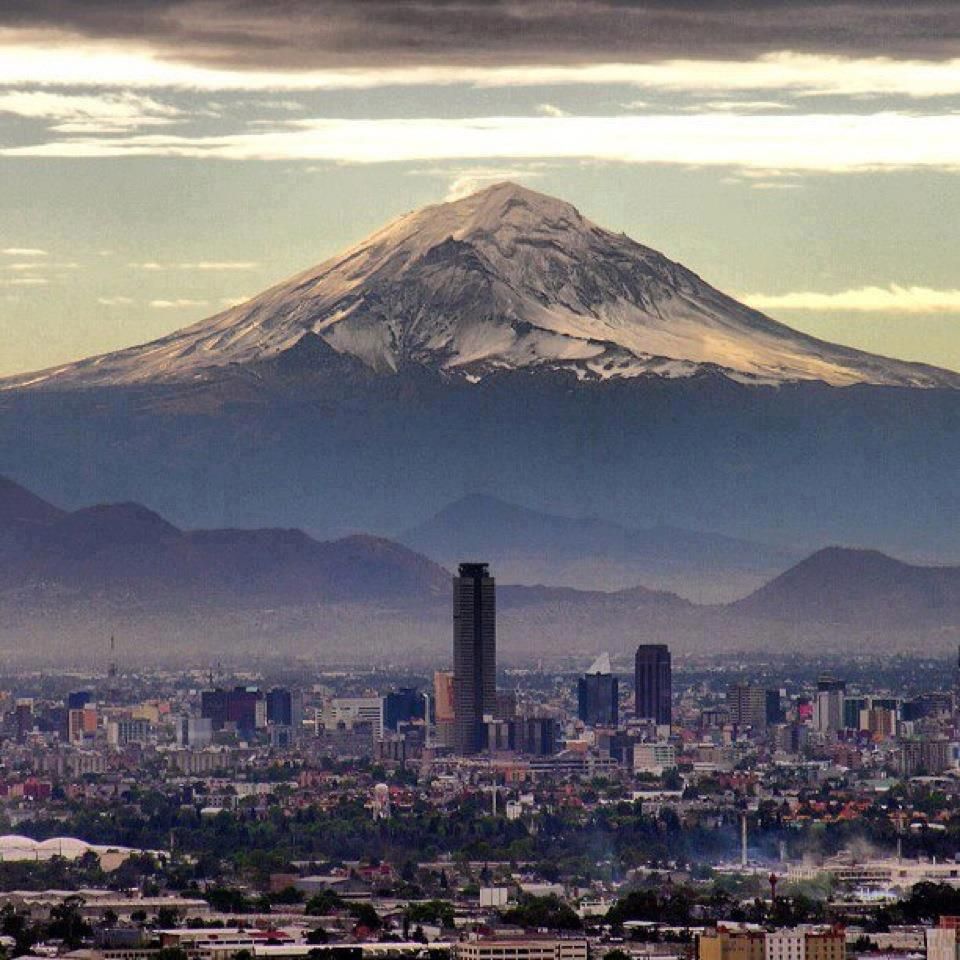 Mexico City With The Popocat Petl Volcano In Background