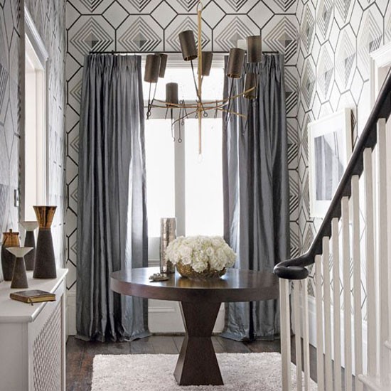 Classic Entrance Hall With Geometric Wallpaper And Statement Lighting