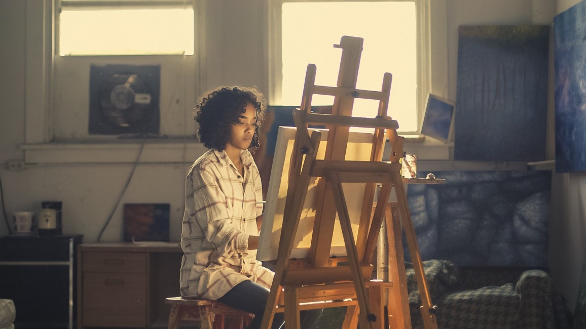 Photo Of Woman Painting In Brown Wooden Easel Stock