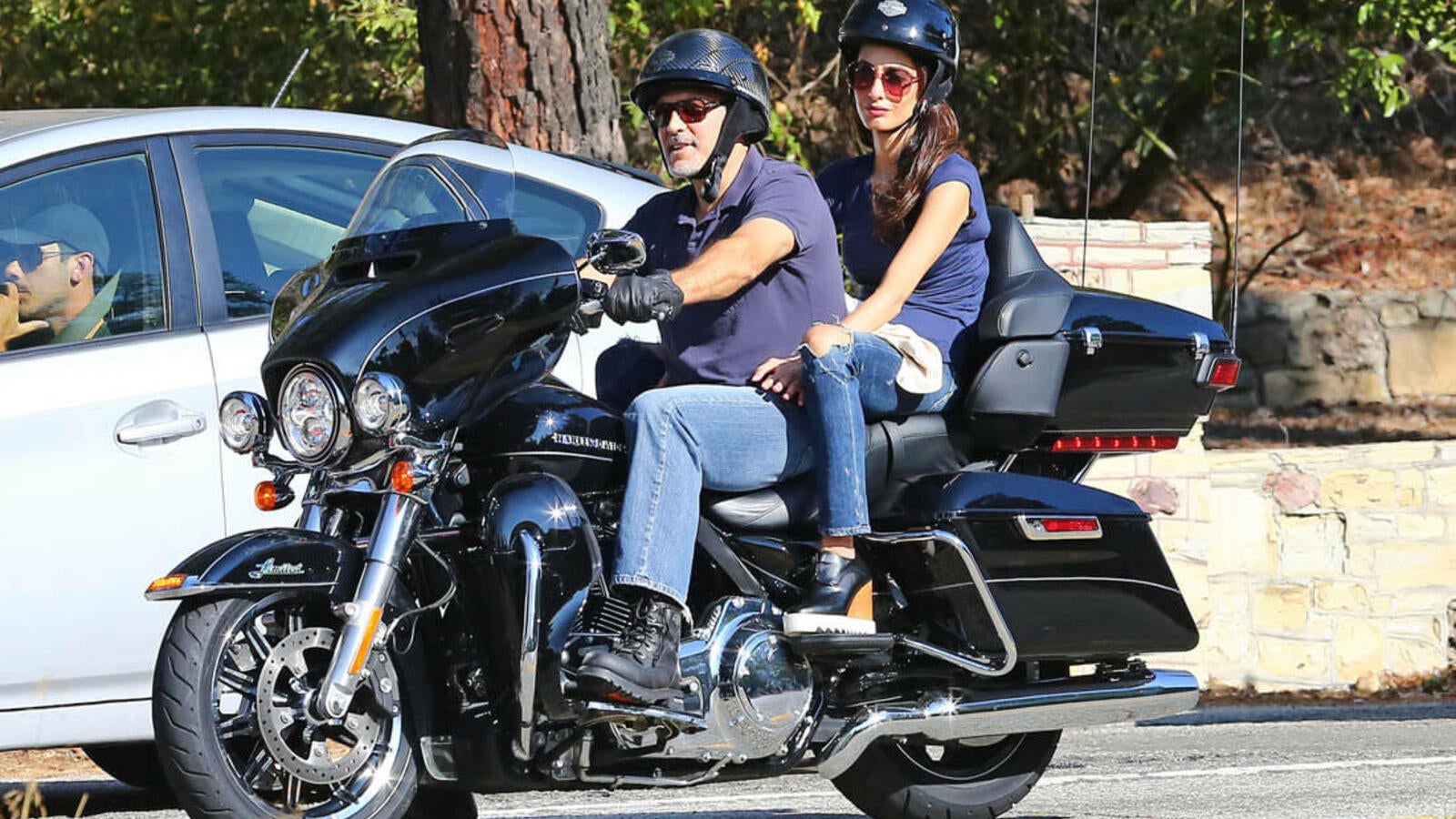 George Clooney shows off bad boy side on motorcycle ride with wife