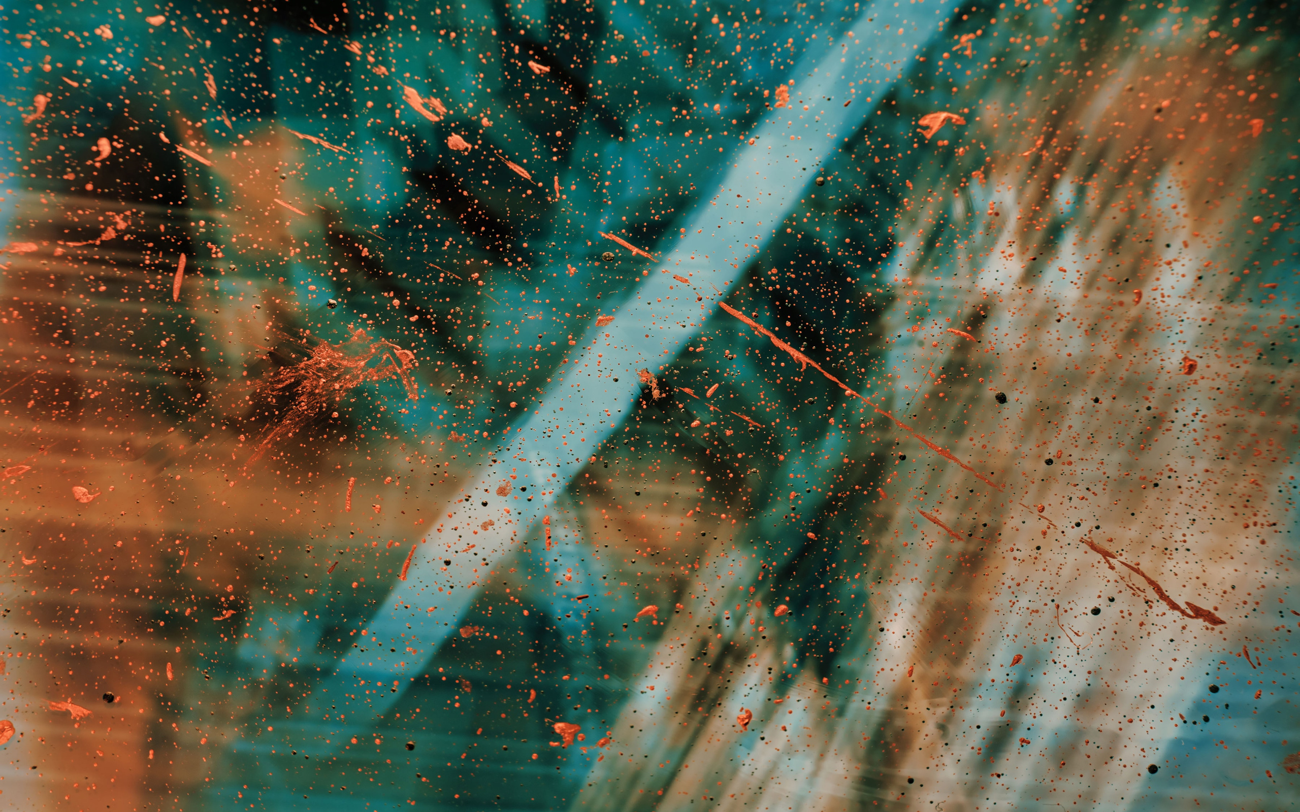 Abstract 4k wallpaper with a blend of teal and orange, resembling a cosmic scene with paint splatters