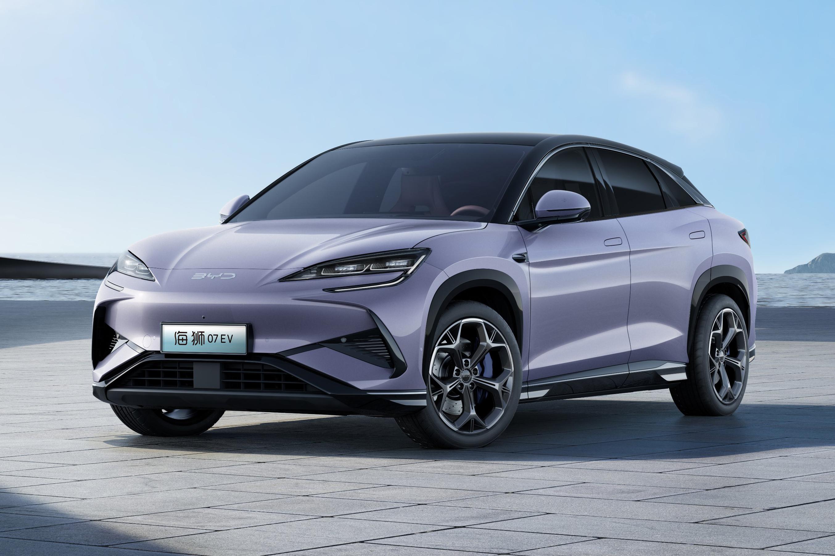 A sleek, lavender BYD Seal electric SUV parked by the ocean, showcasing its modern design and eco-friendly technology