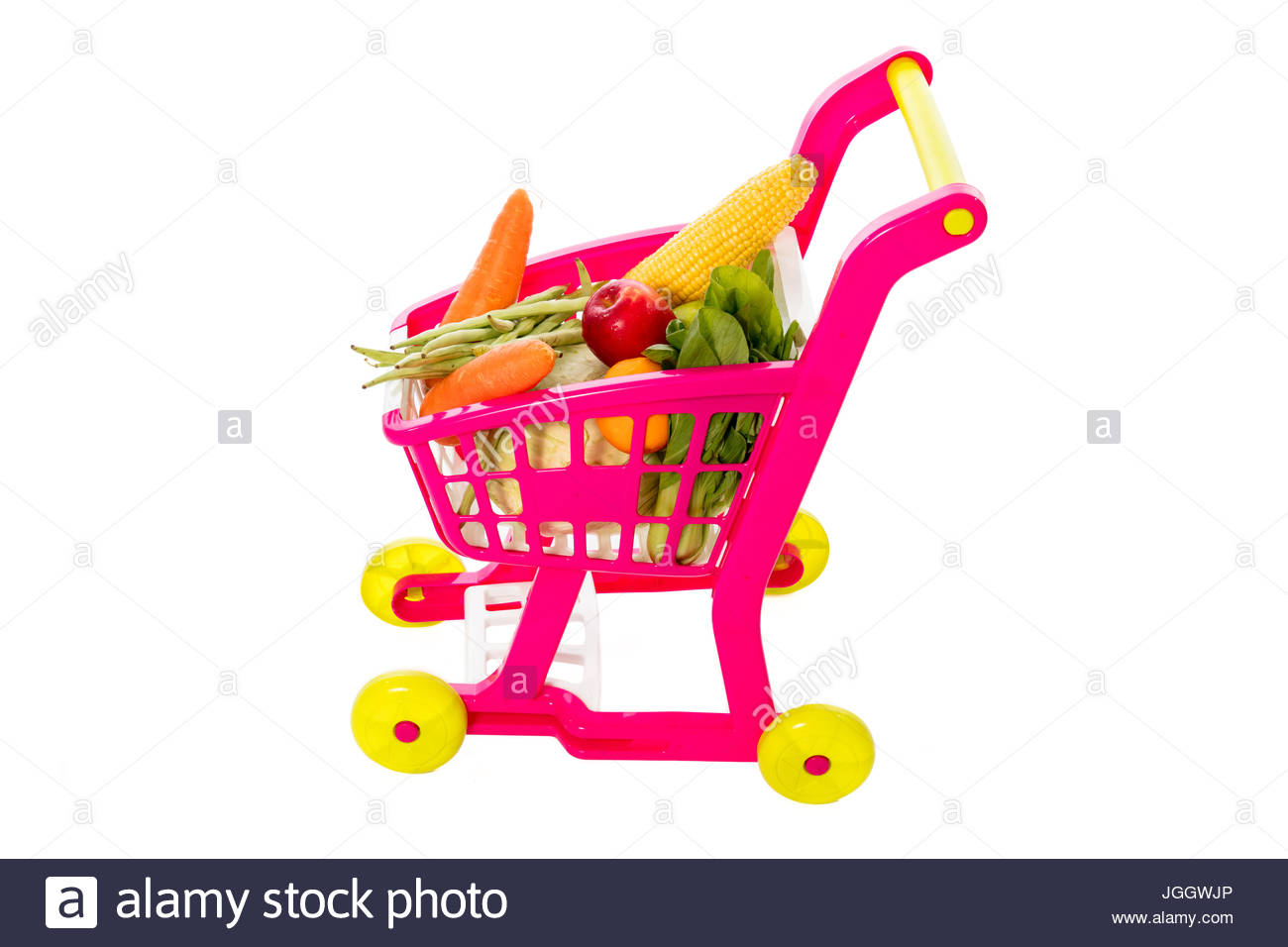 A Toy Trolley With Vegetables In Isolated White Background Stock