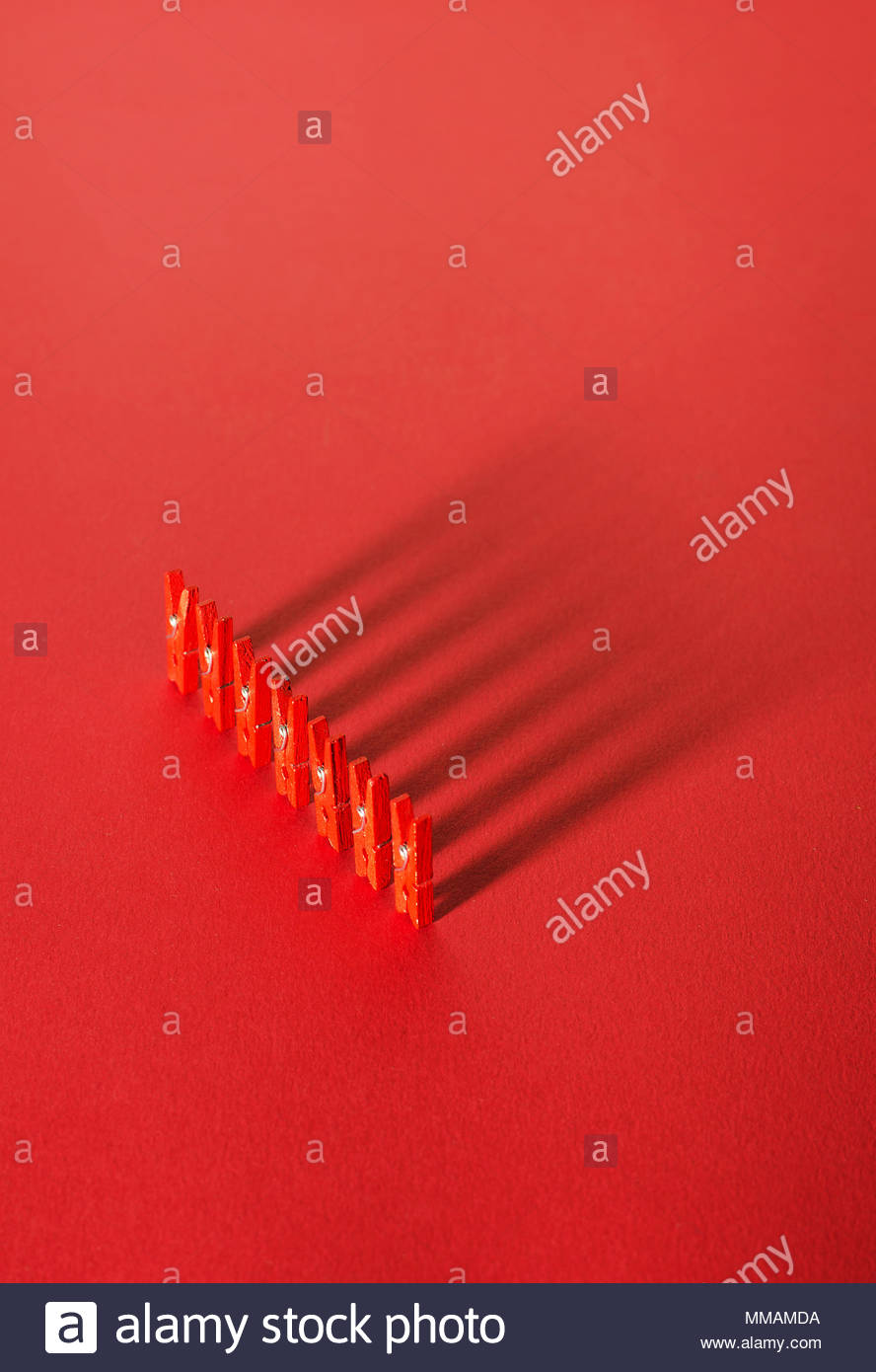 Red Laundry Clips Anized In A Row Over Background Stock