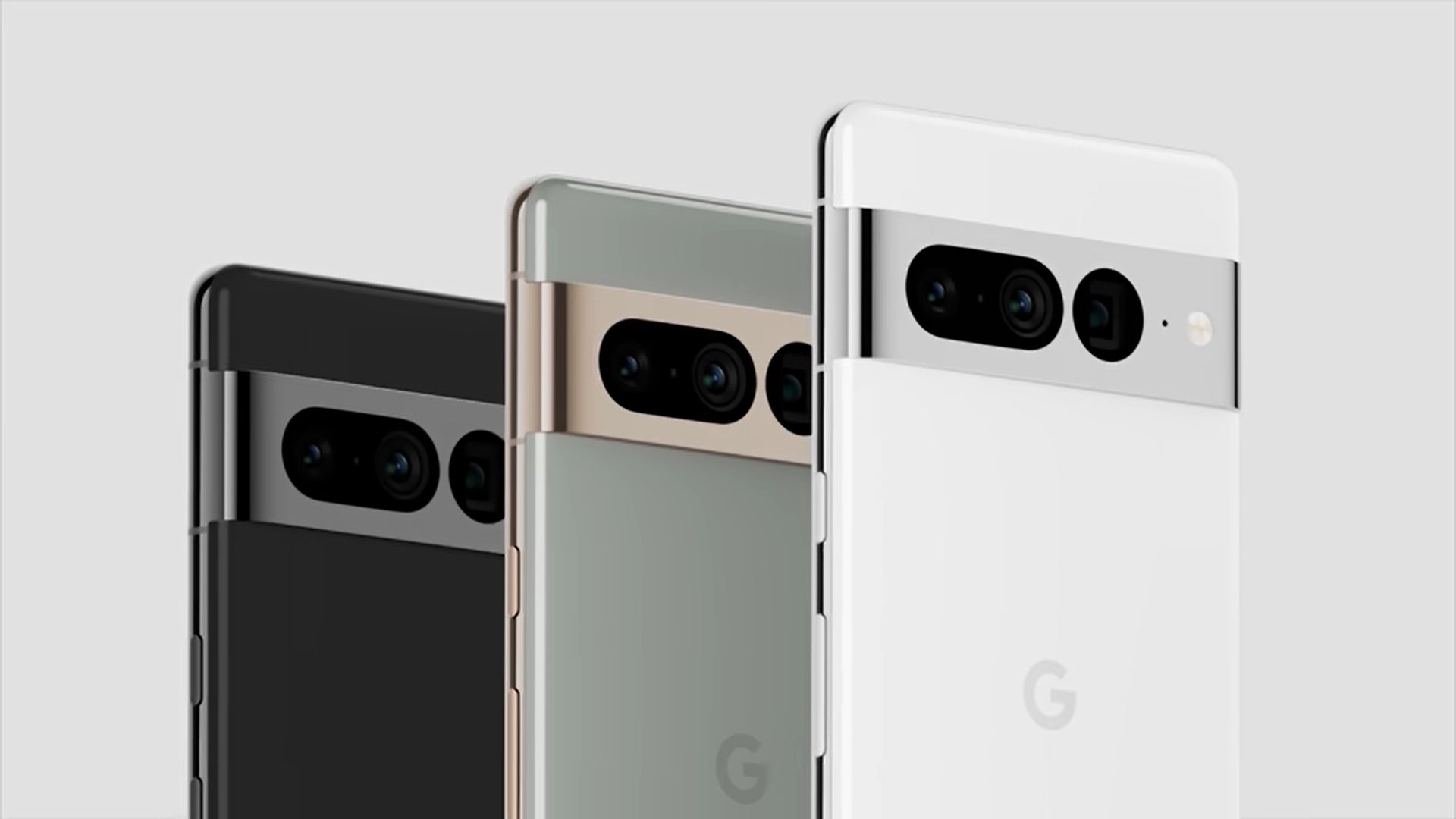 Close-up of three Google Pixel 9 smartphones showcasing the camera bar and different color options: black, silver/grey, and white