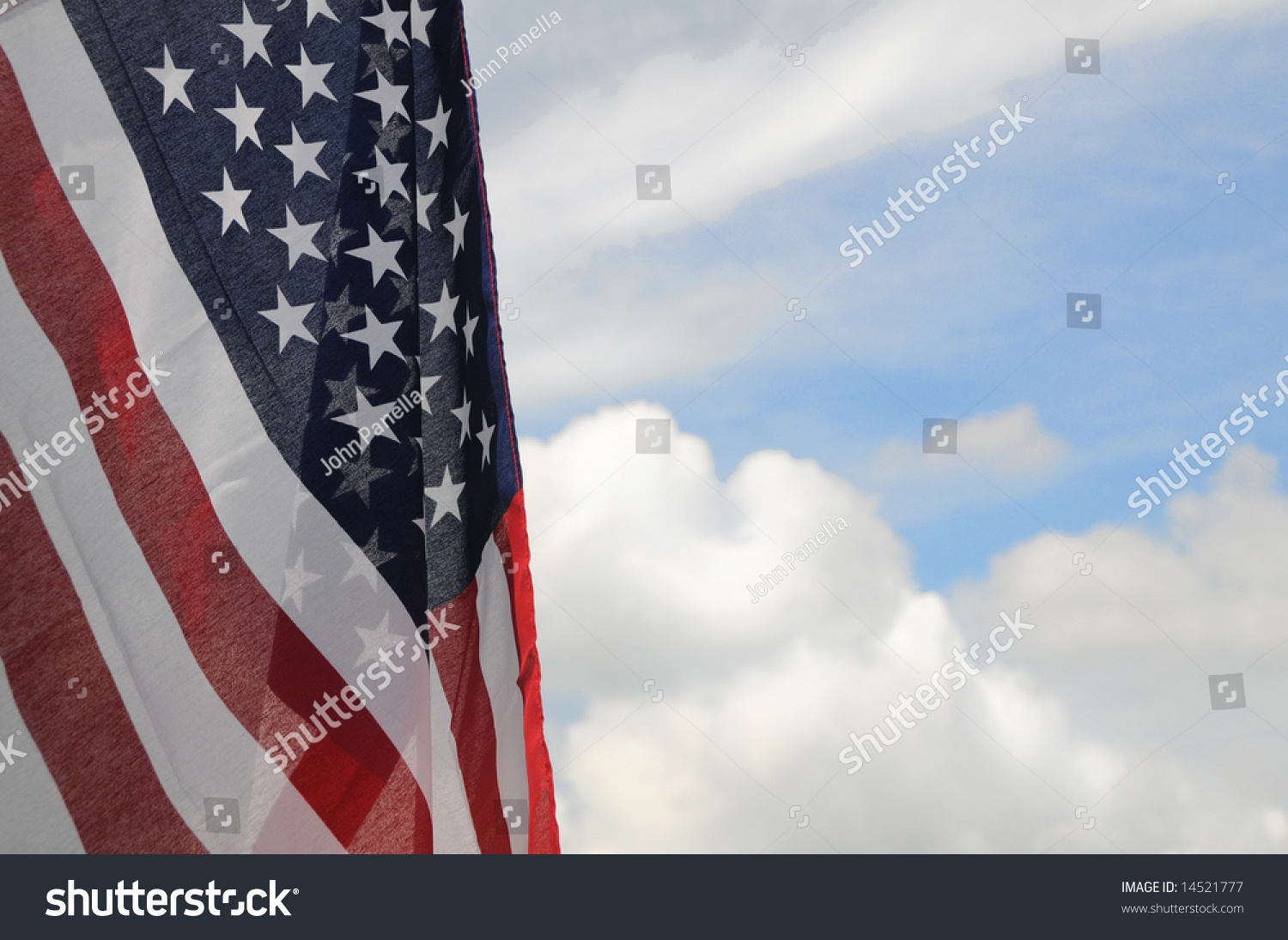 United States Flag With Partly Cloudy Sky Background Stock