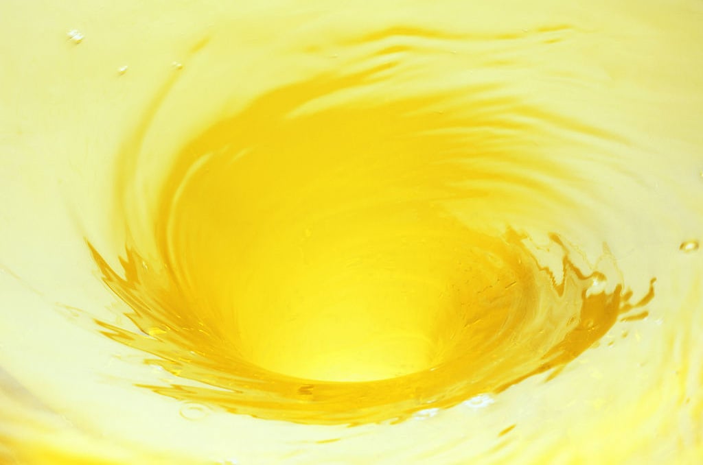 This is the Orange juice whirlpool water wave background image You