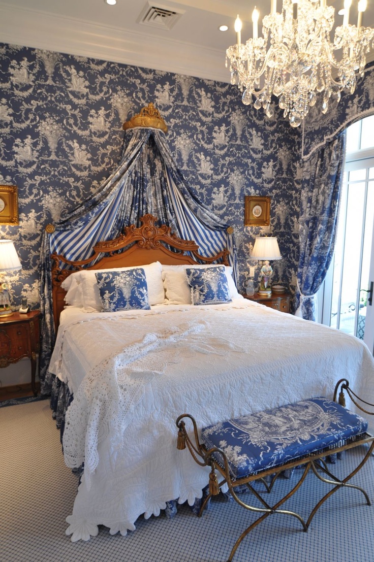 French Style Bedroom With Deep Blue Toile Fabric On The Walls Draping