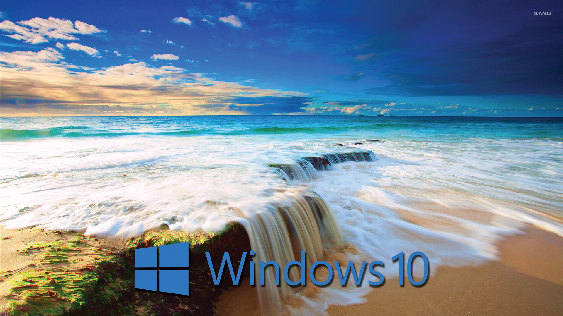 Windows 10 blue text logo on the golden beach wallpaper   Computer