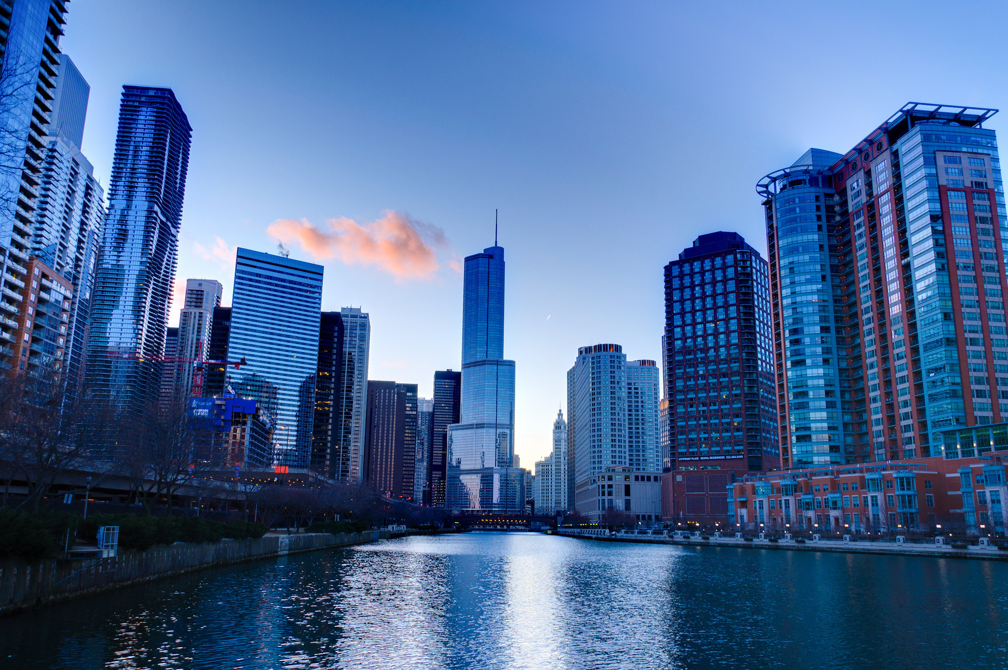 Chicago skyline at dusk with the Chicago River in the foreground