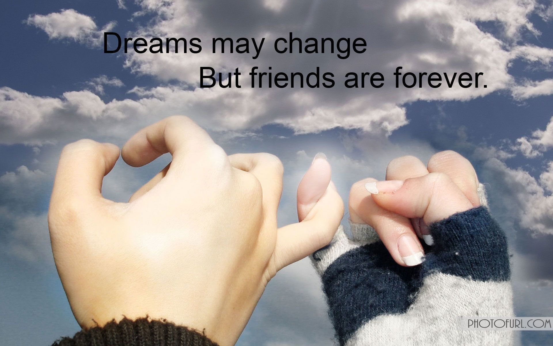 Two hands pinky swearing against a cloudy sky, symbolizing a strong and lasting friendship