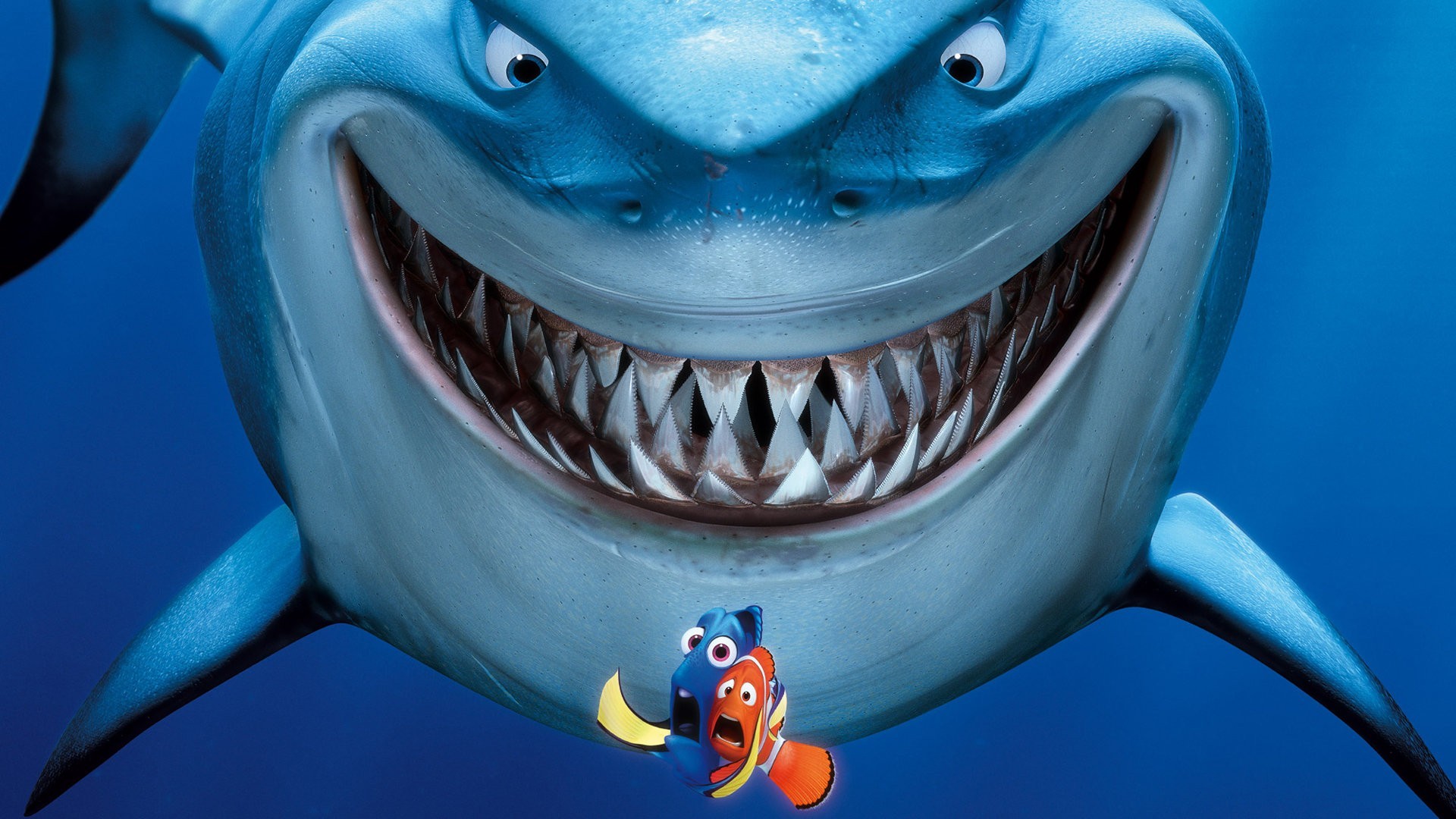 Bruce the shark from Finding Nemo smiles menacingly at Marlin and Dory