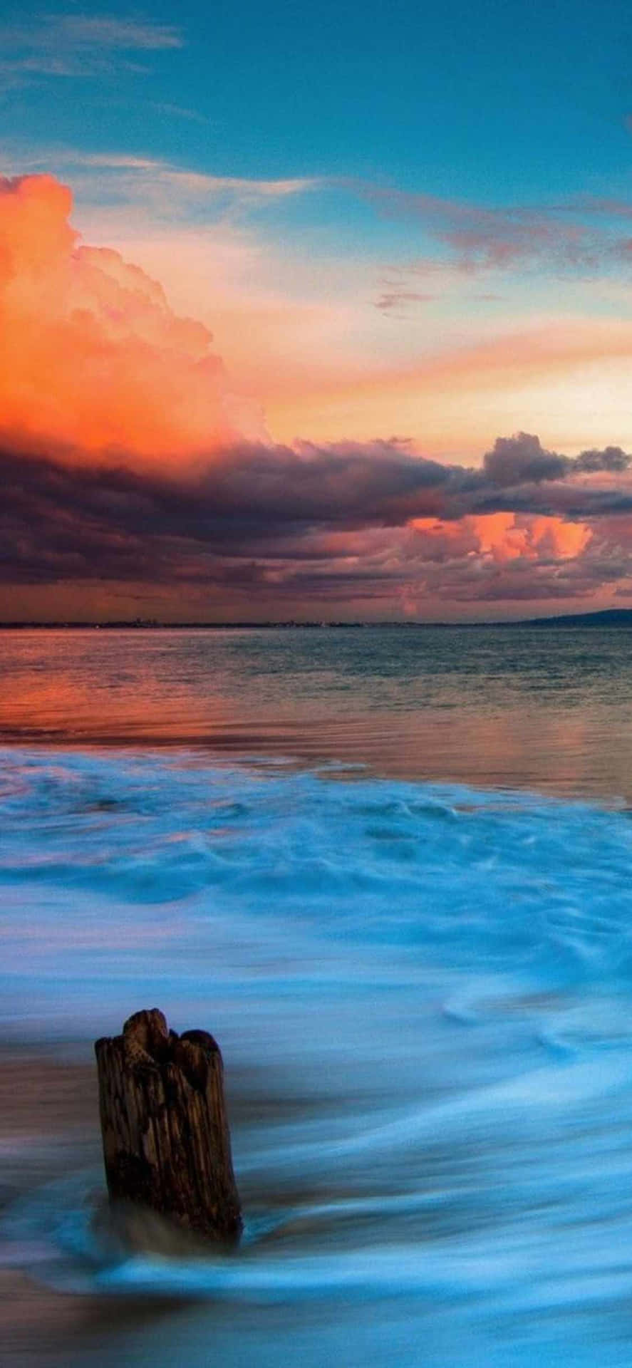 An Idyllic Sunset Over Malibu California Seen Through The Wallpaper