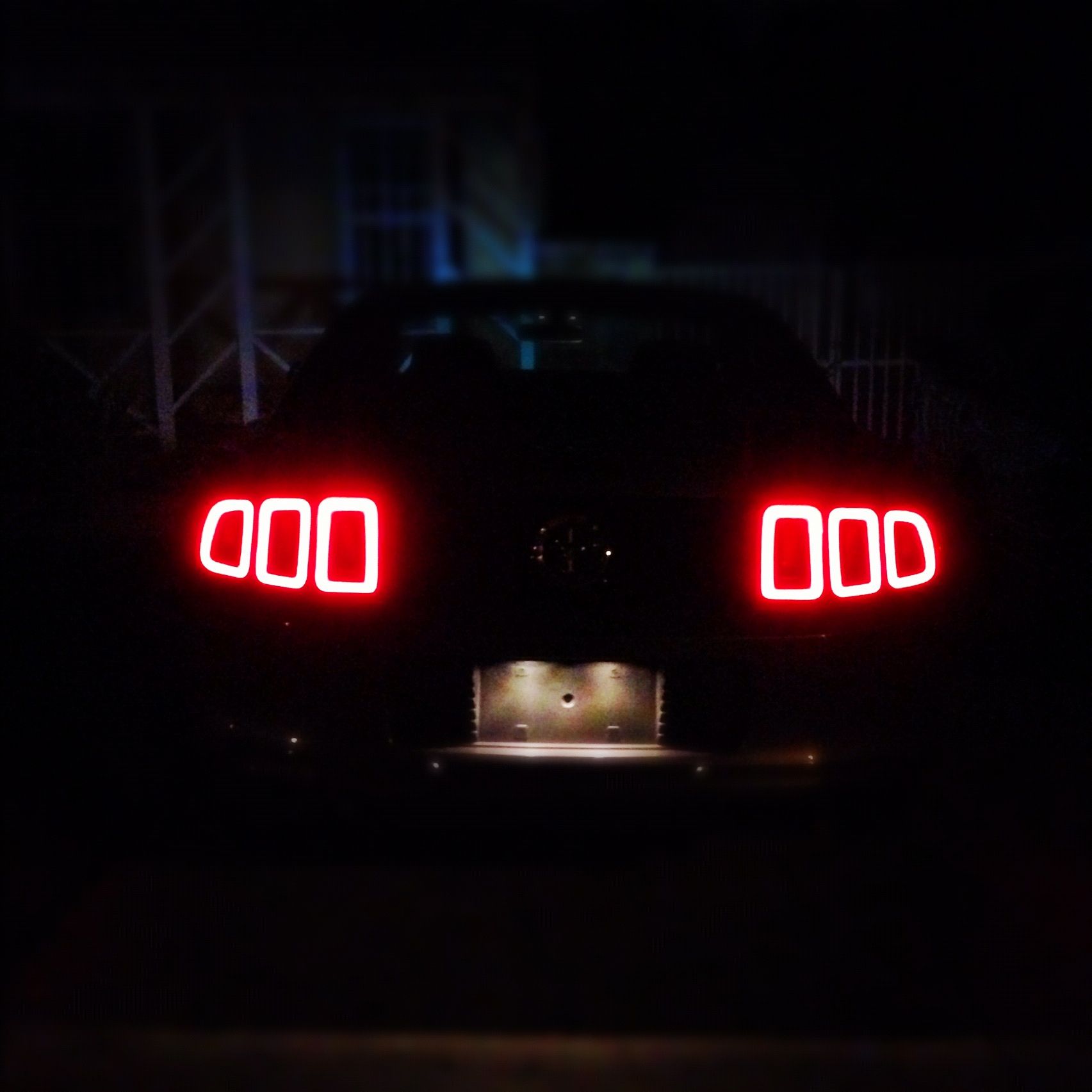 The Rear Tail Lights Of My Ford Mustang At Night