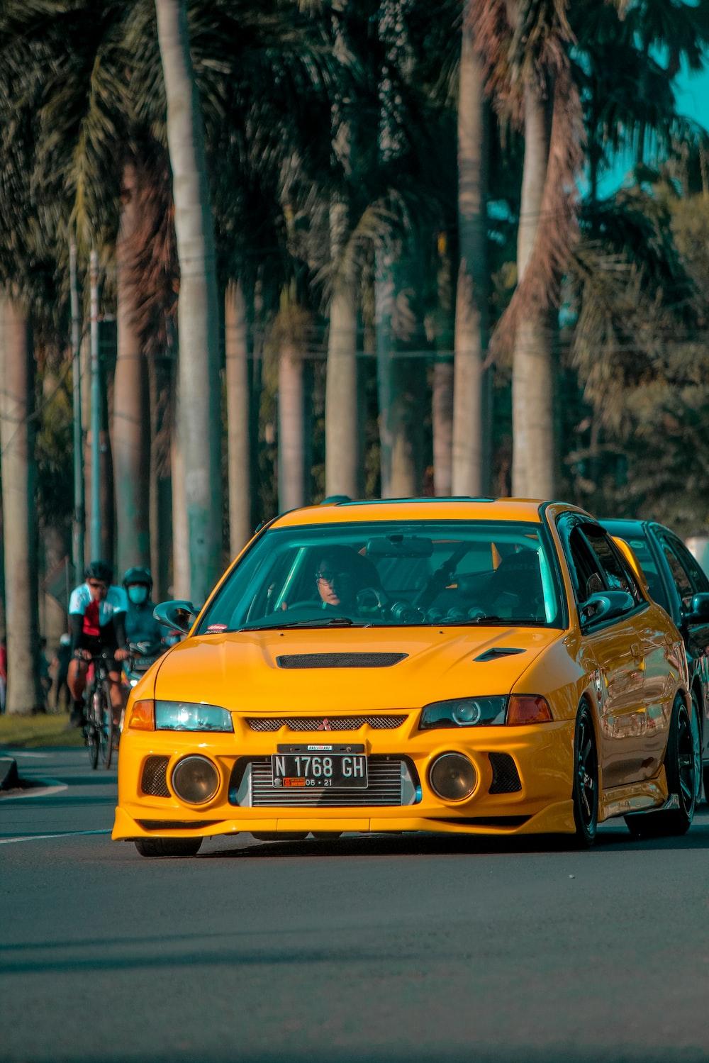 Yellow Porsche On Road During Daytime Photo Speed Image