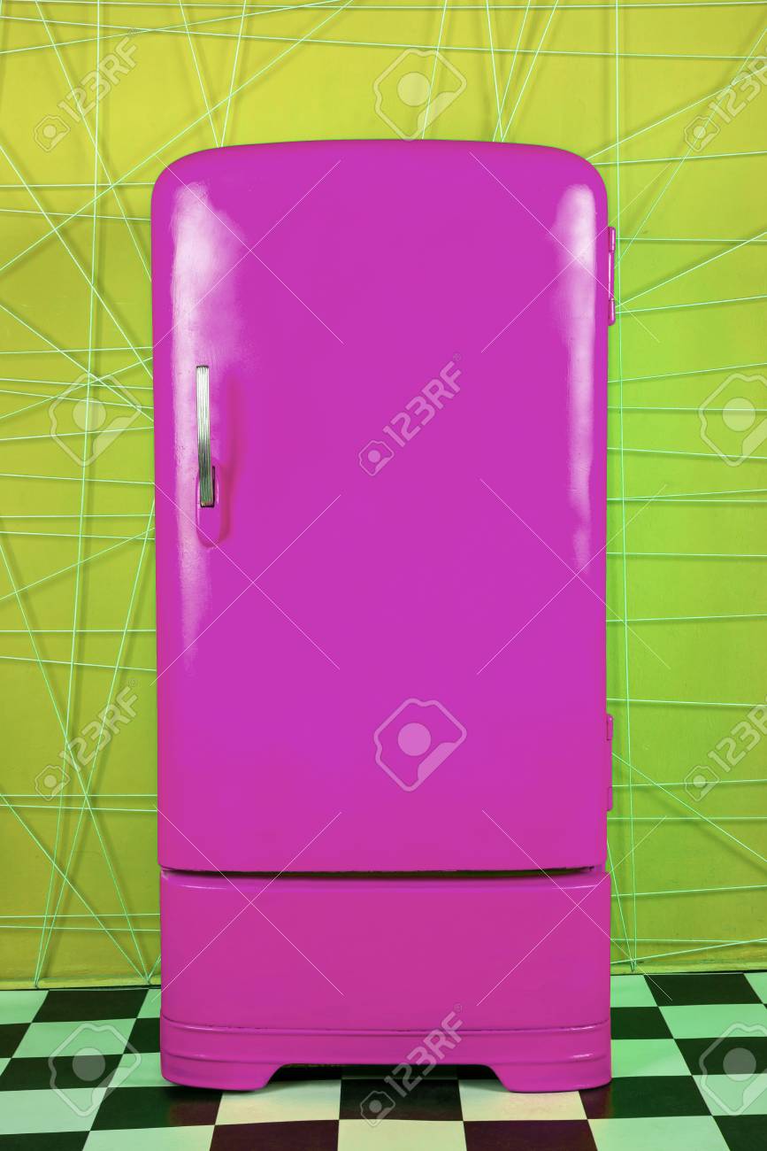Old Vintage Purple Refrigerator On A Yellow Background Vertical