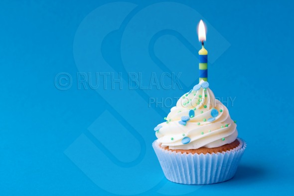 Blue BirtHDay Cupcake On Background With Copy Space At The Side