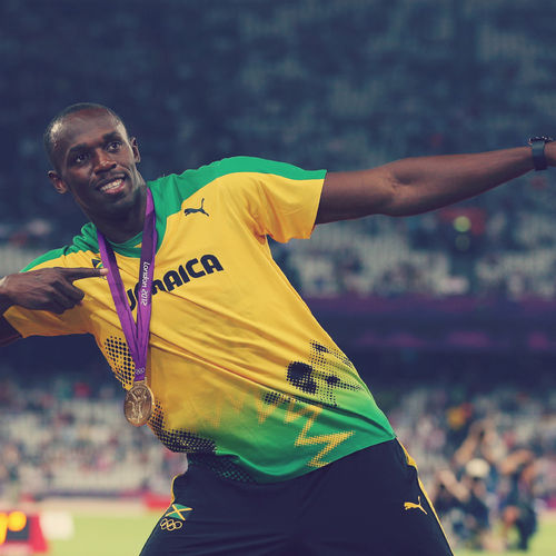 Usain Bolt With Medal Wallpaper For iPhone