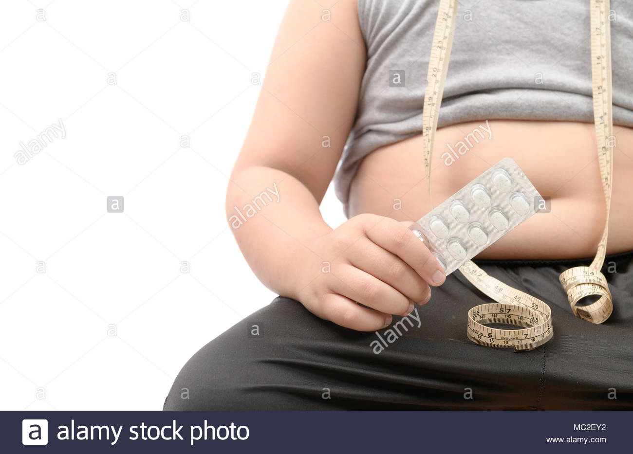 Overweight Fat Boy With Obese Belly Taking Slimming Pills Isolated