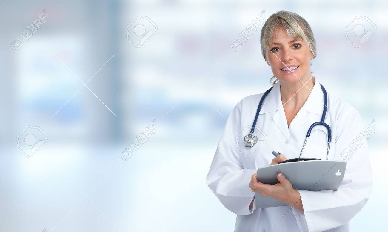 Mature Medical Doctor Woman Over Hospital Background Stock Photo