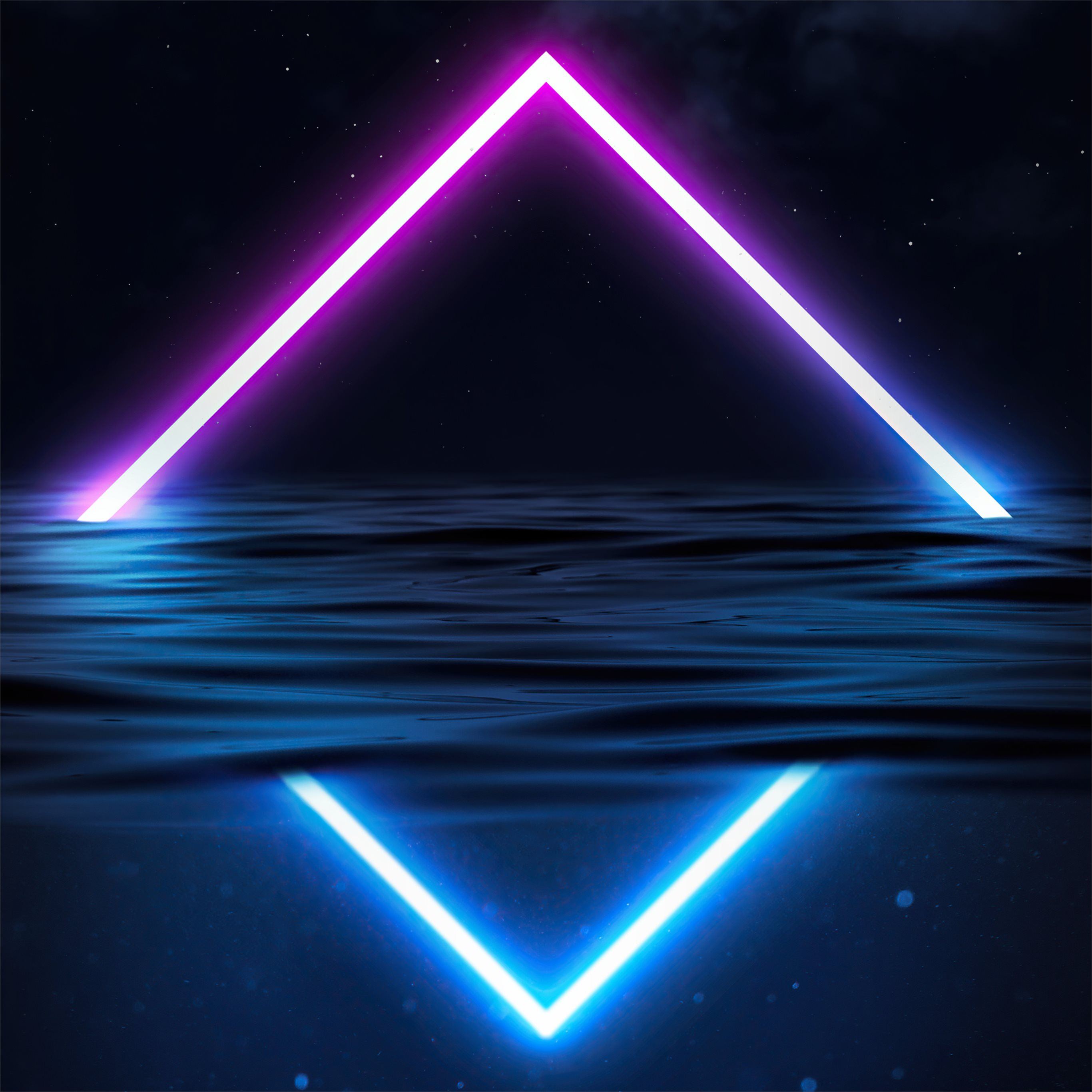 A vibrant neon diamond shape glows above a dark, rippling body of water, its reflection mirrored below in cool blue. The backdrop is a night sky speckled with stars