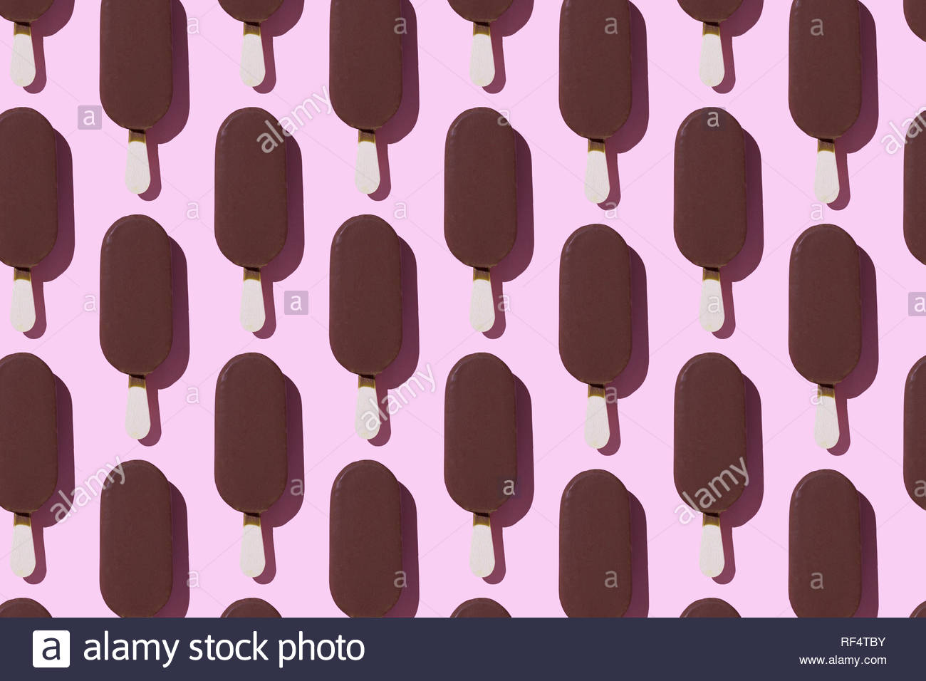 Ice Cream Popsicles Organized In A Row Over Pink Background Stock