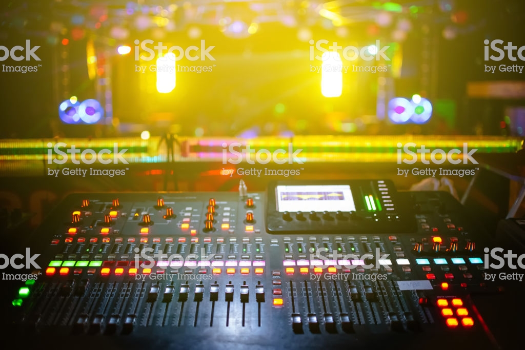 Music Mixer With Stage Concert Background Blurred Yellow Light