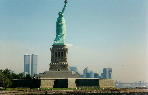 Statue Of Liberty With World Trade Center In Background