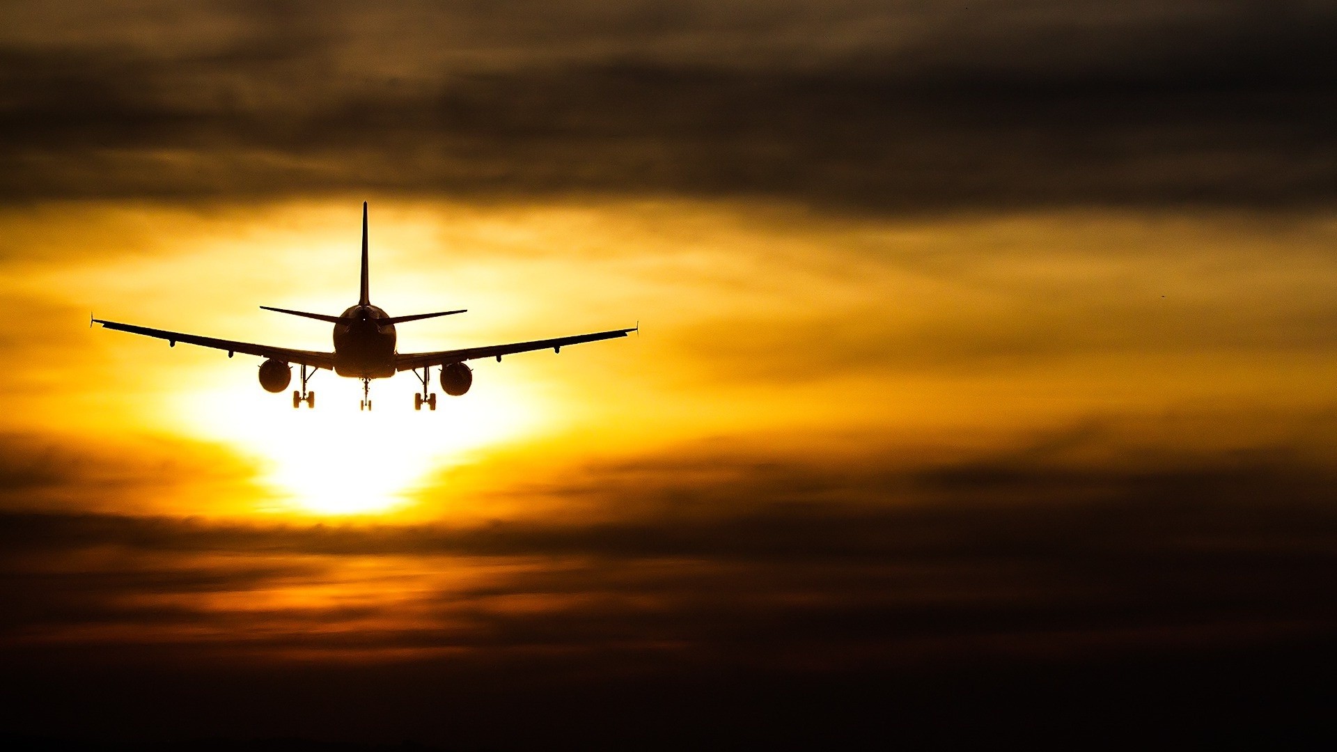 Sunset Passenger Plane Full HD Desktop Background
