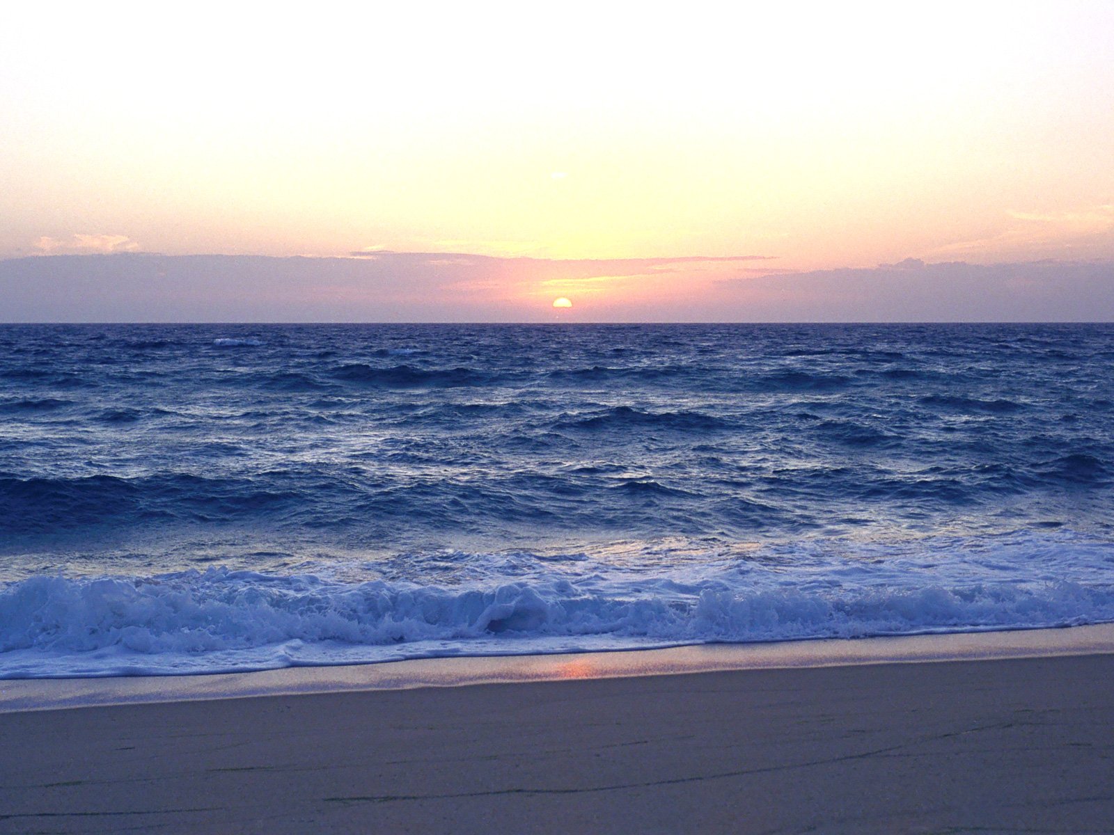 Beach With Sunset And Waves Of The Atlantic Ocean Portugal Coast