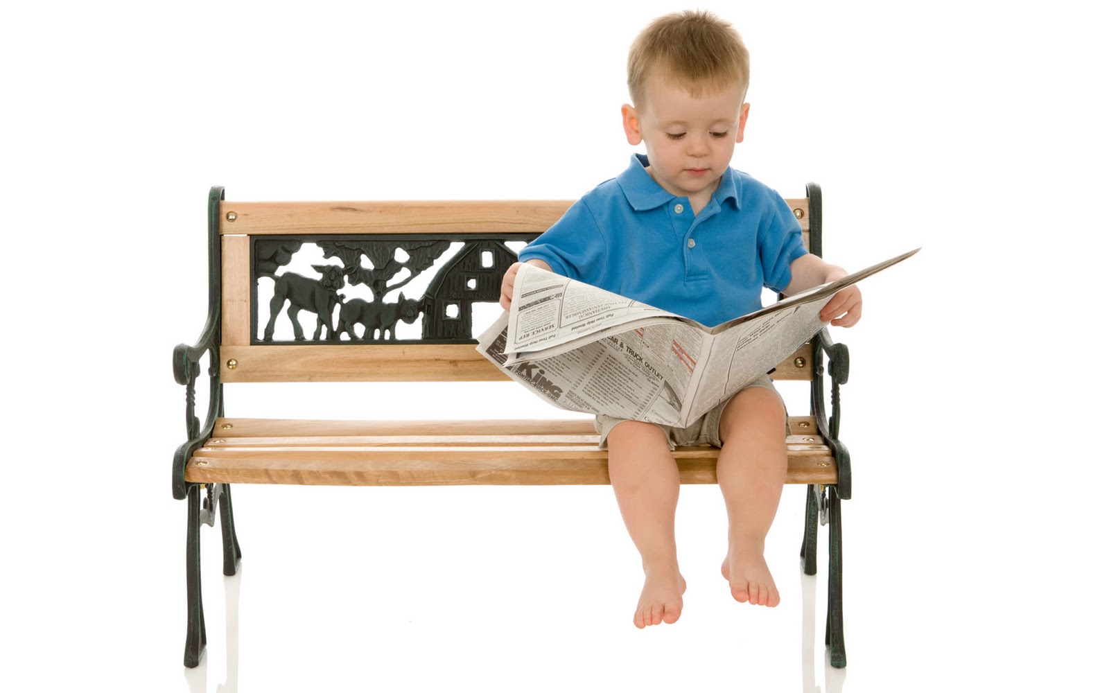 Cute Little Boy Reading Newspaper Wallpaper Credit