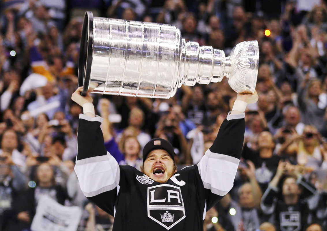 Los Angeles Kings Captian Dustin Brown Hoists The Stanley Cup After