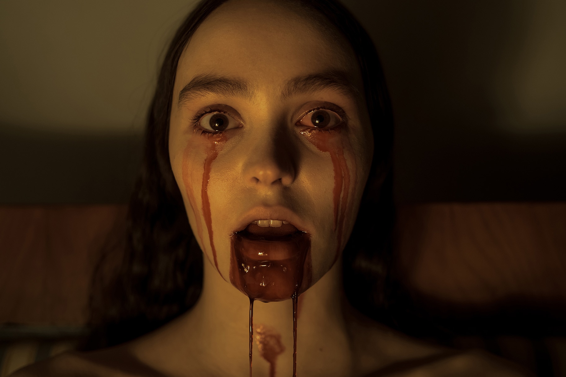 A chilling close-up of a young woman, likely inspired by Nosferatu, with blood dripping from her eyes and mouth, evoking a sense of horror and the macabre
