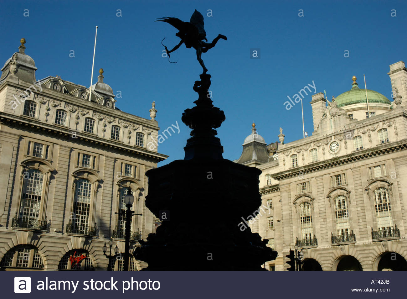 Silhouette Of Eros Statue With Victorian Buildings In The