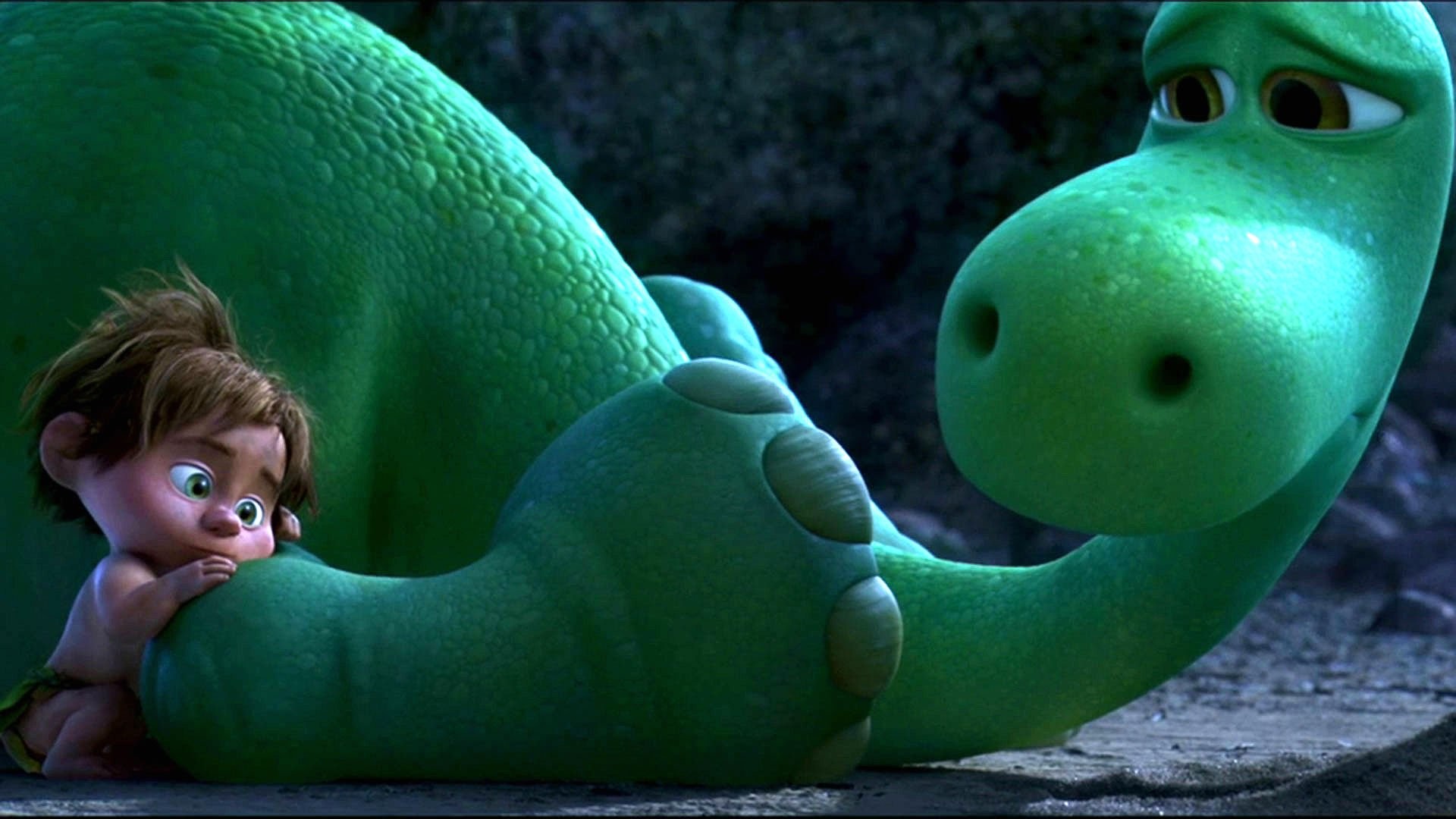 A heartwarming scene from Disney Pixar's 'The Good Dinosaur' featuring Arlo the Apatosaurus and Spot the caveboy