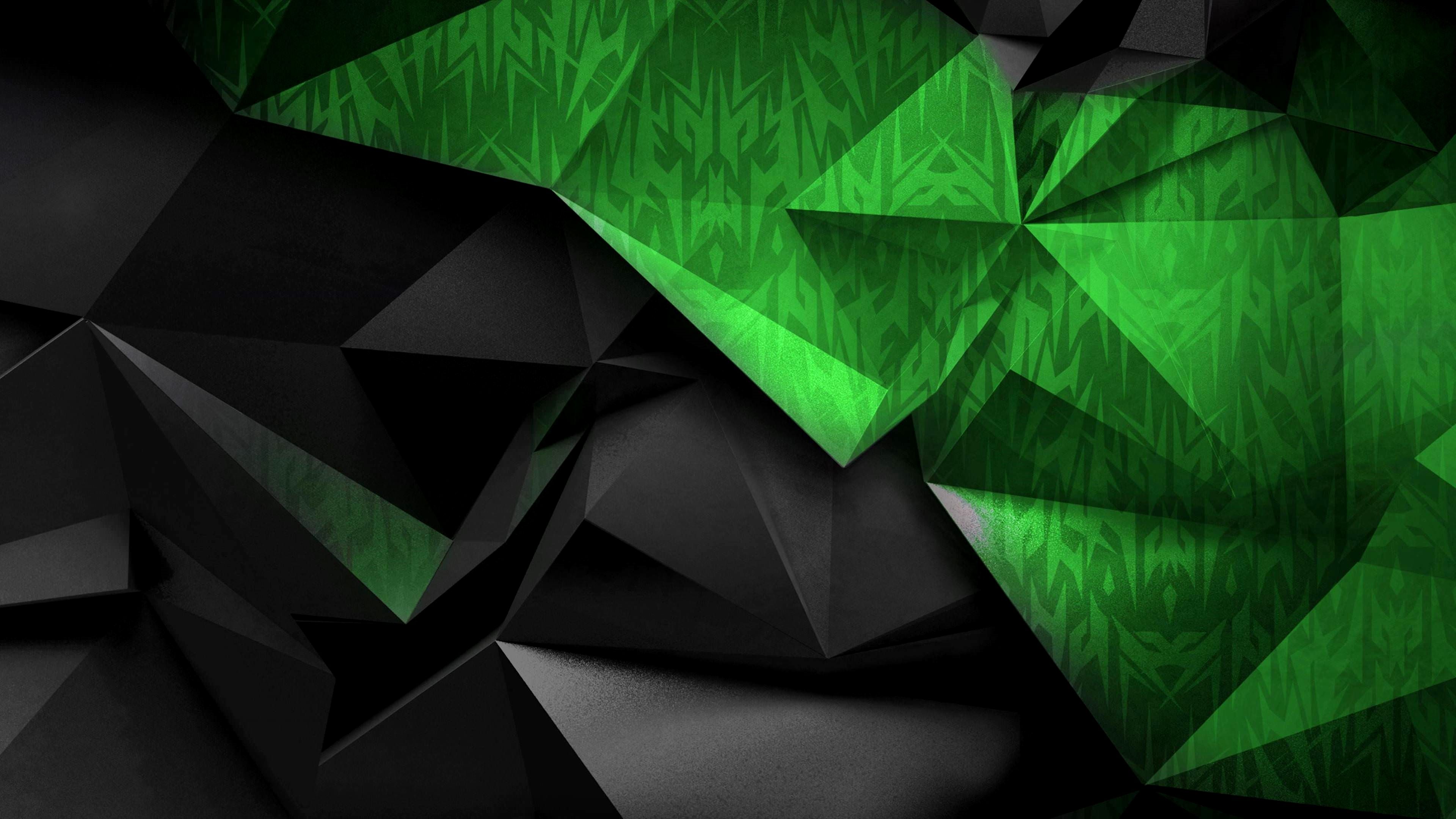 Abstract 4K wallpaper with low-poly black facets and a vibrant green patterned section