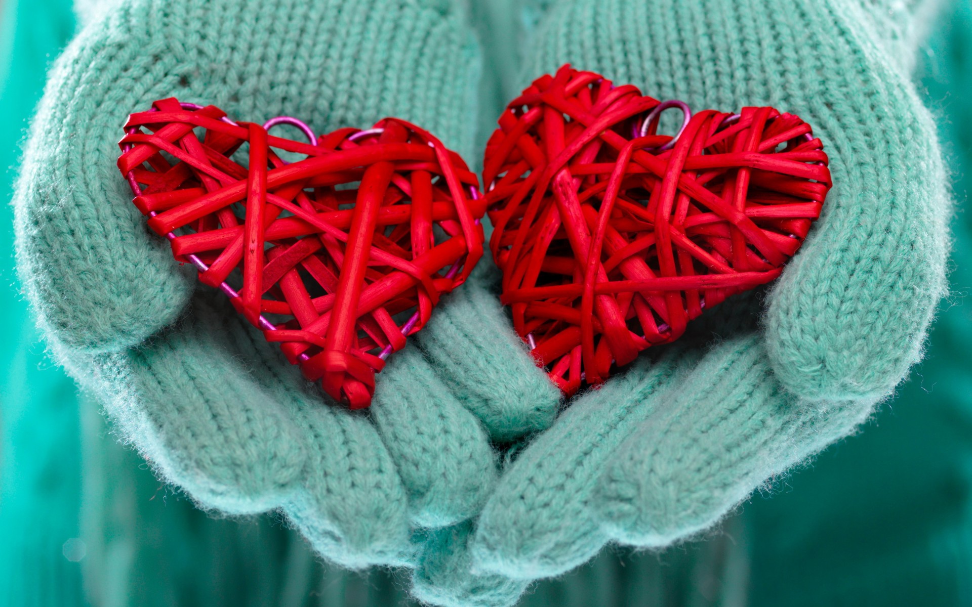 Red Hearts In Hand With Blue Mittens Winter Love Background