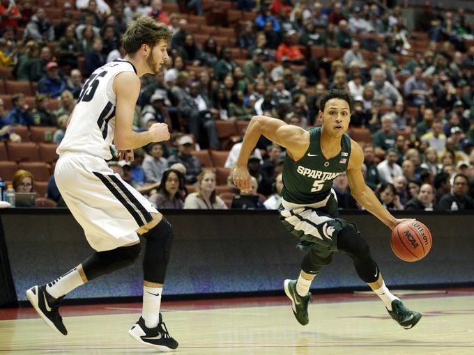 Michigan State guard Bryn Forbes right dribbles as 680x510