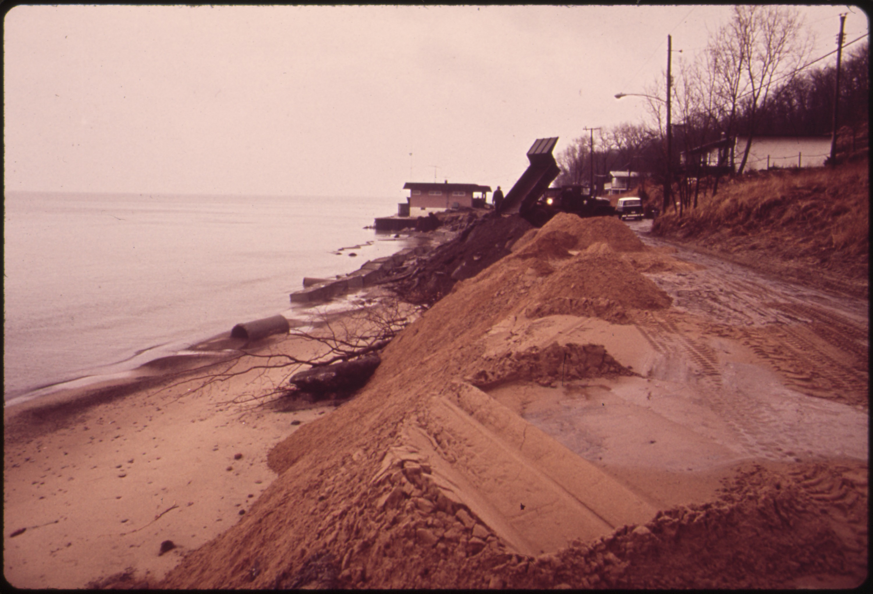 BACKGROUND IS THREATENED BY BEACH EROSION US ARMY CORPS OF ENGINEERS
