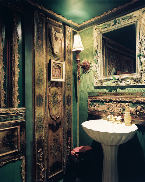  Bathroom A powder room with walls upholstered in green silk moire