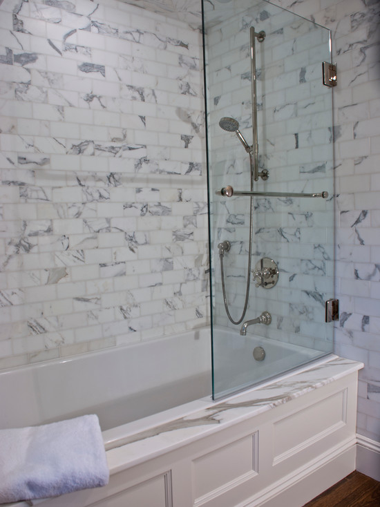 Gorgeous Bathroom With Carrara Marble Subway Tile And Marbled Bath