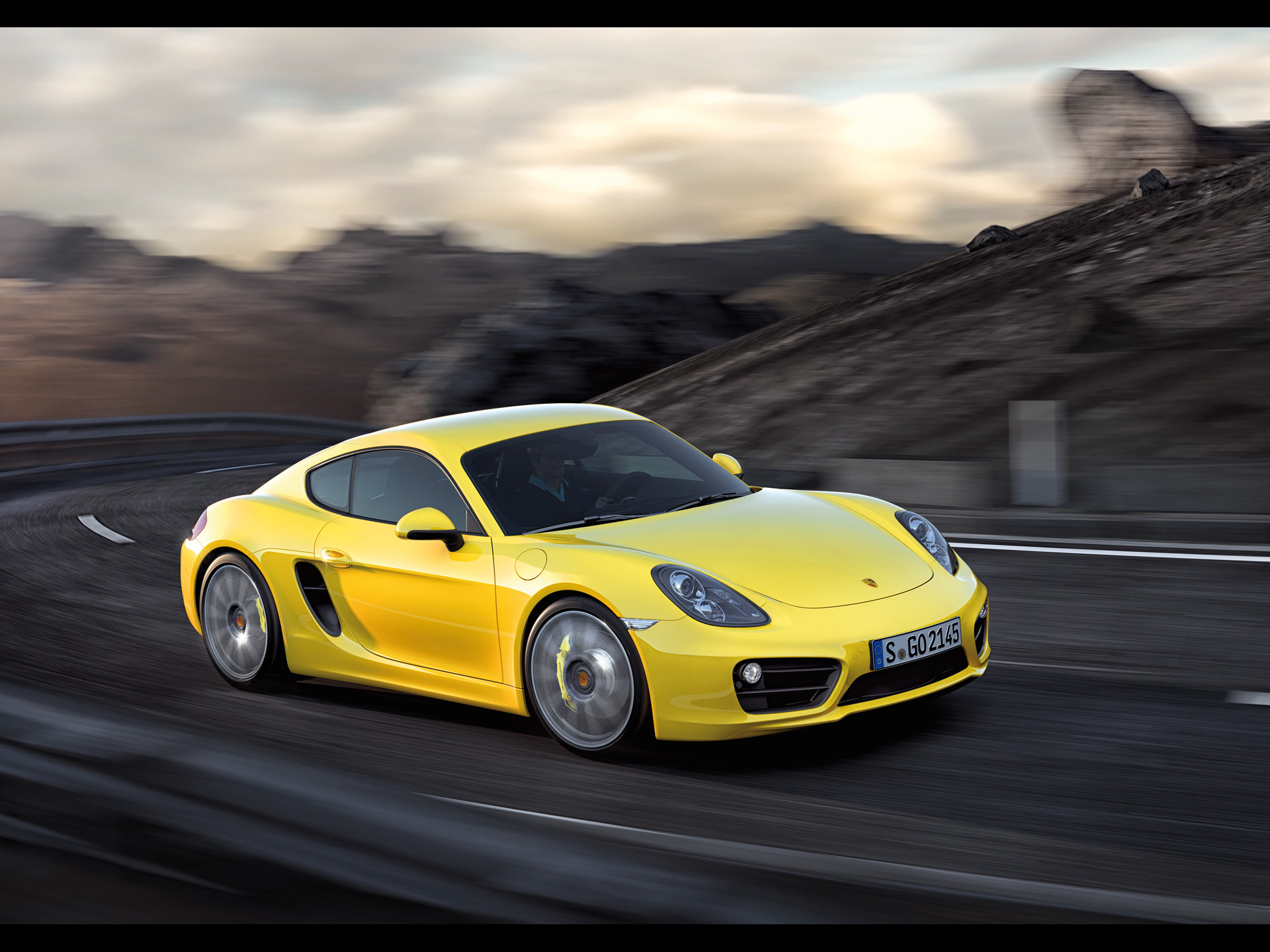 Yellow Porsche Cayman Motion Side Angle Wallpaper