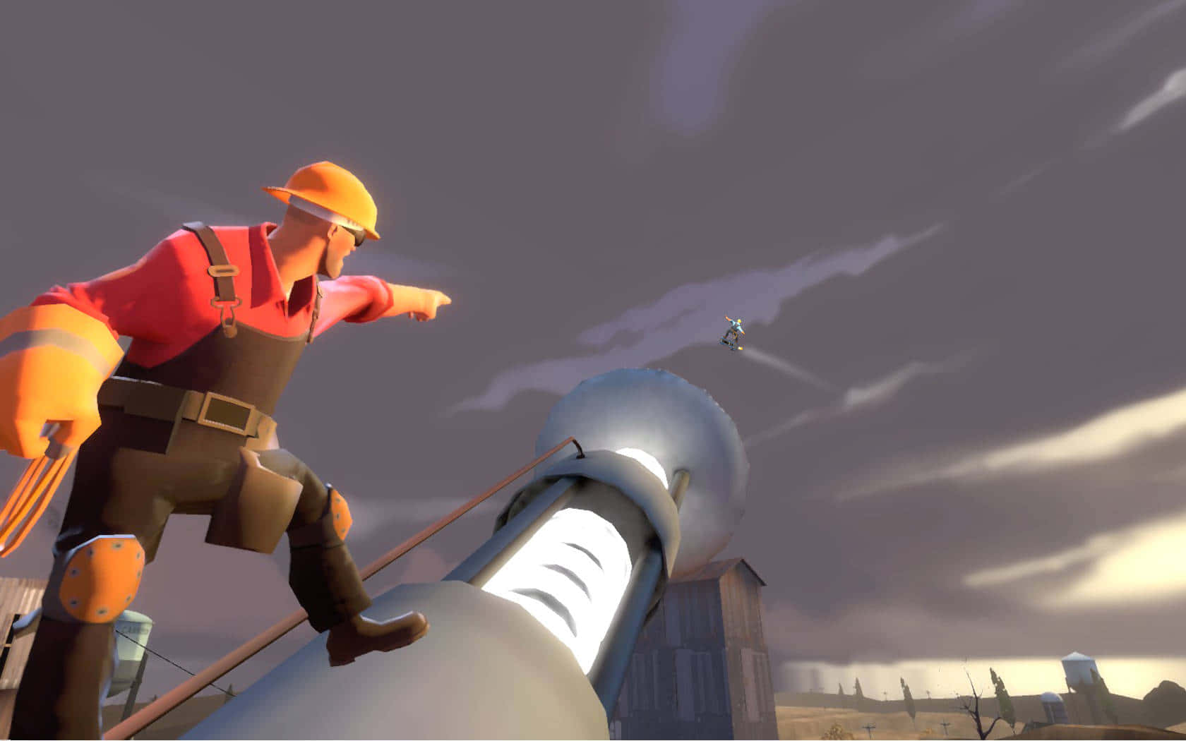 A Man Is Standing On Top Of Large Object Wallpaper