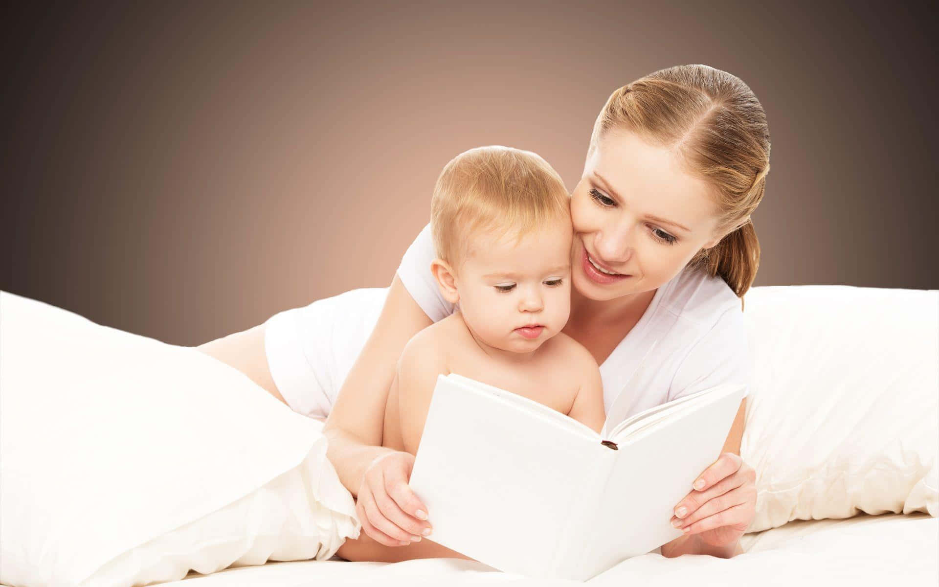 Mother Reading A Book To Baby Picture Wallpaper