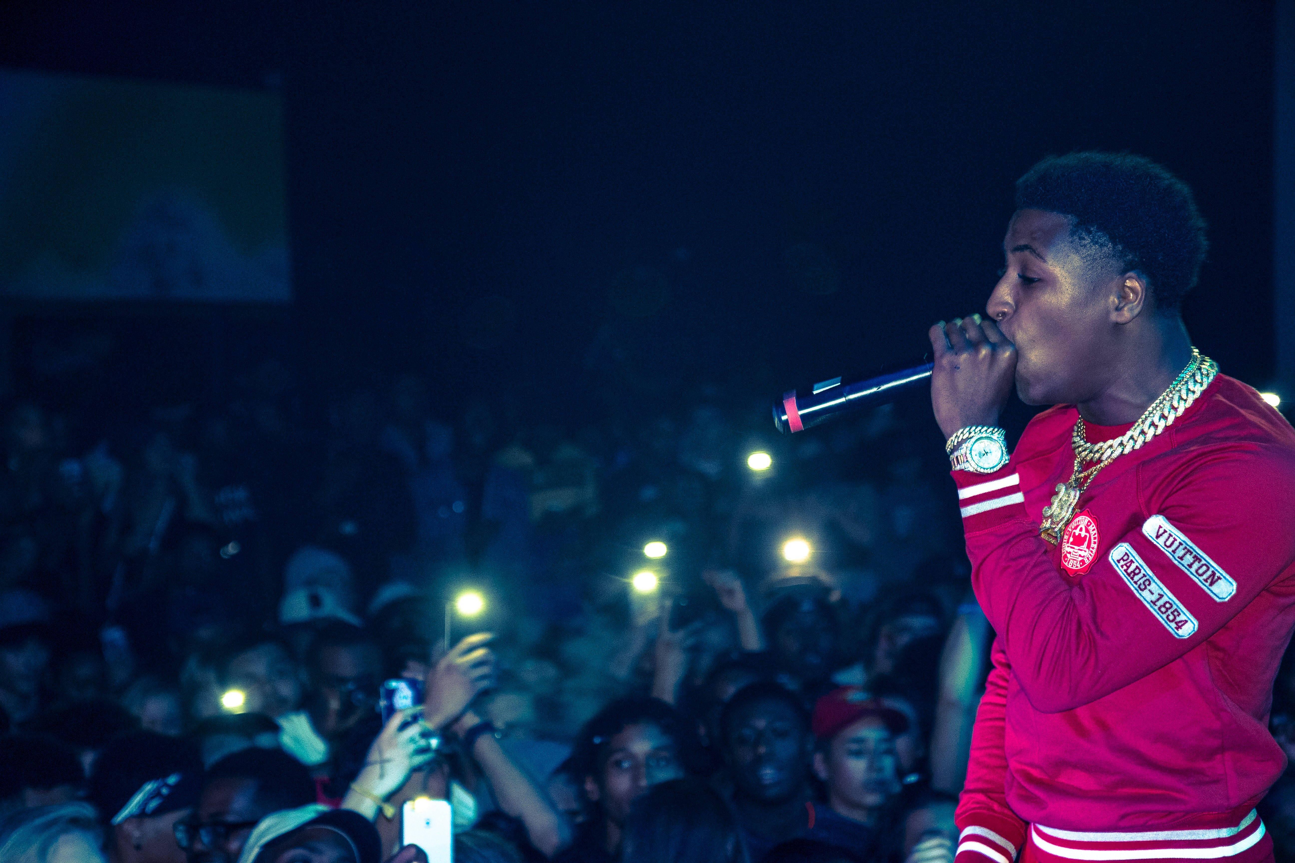 Download NBA Youngboy performs onstage in front of an excited