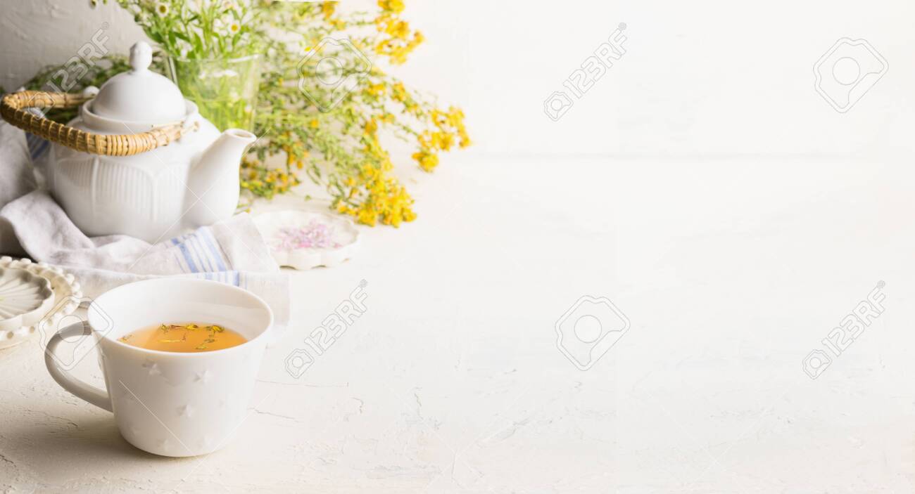 Herbal Tea Background With Cup Yellow Pot And