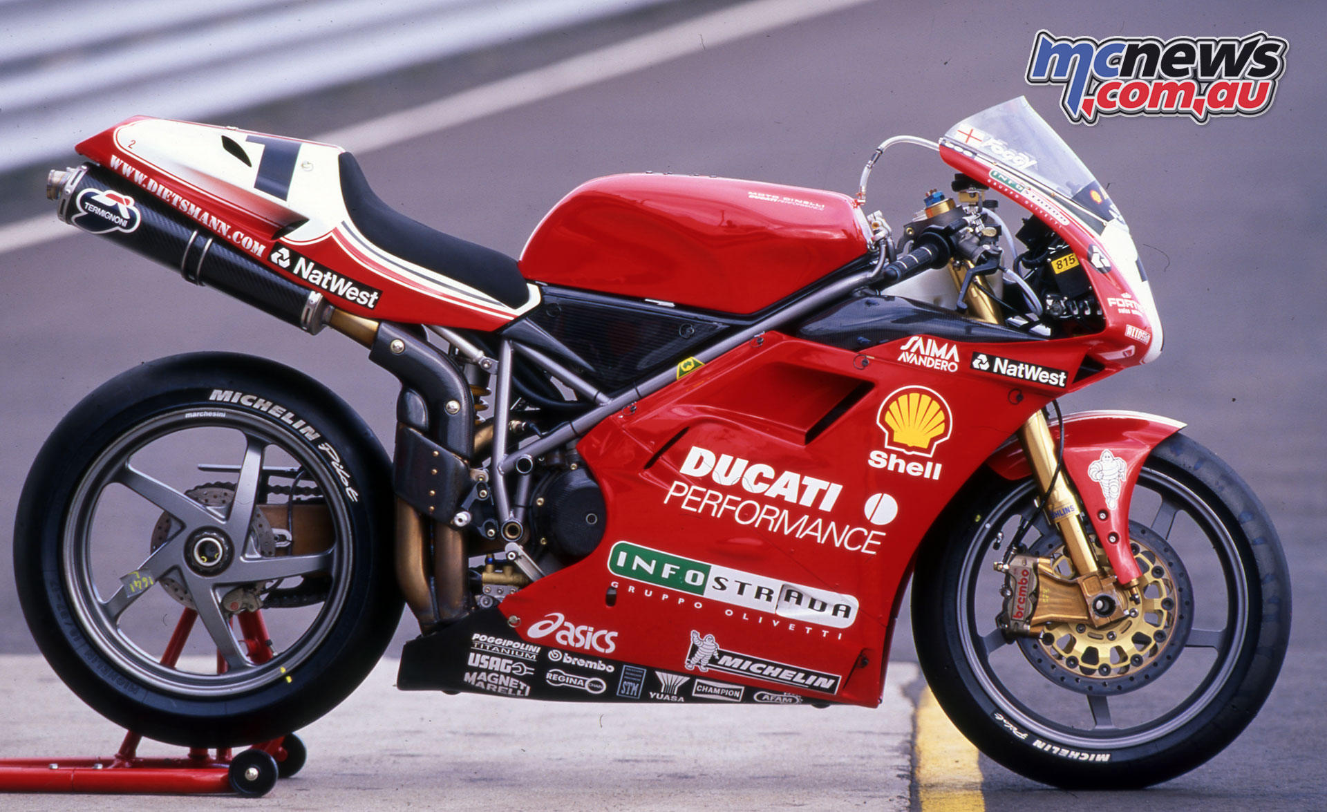 Ducati 996 racing motorcycle in red and white livery, prepared for a race