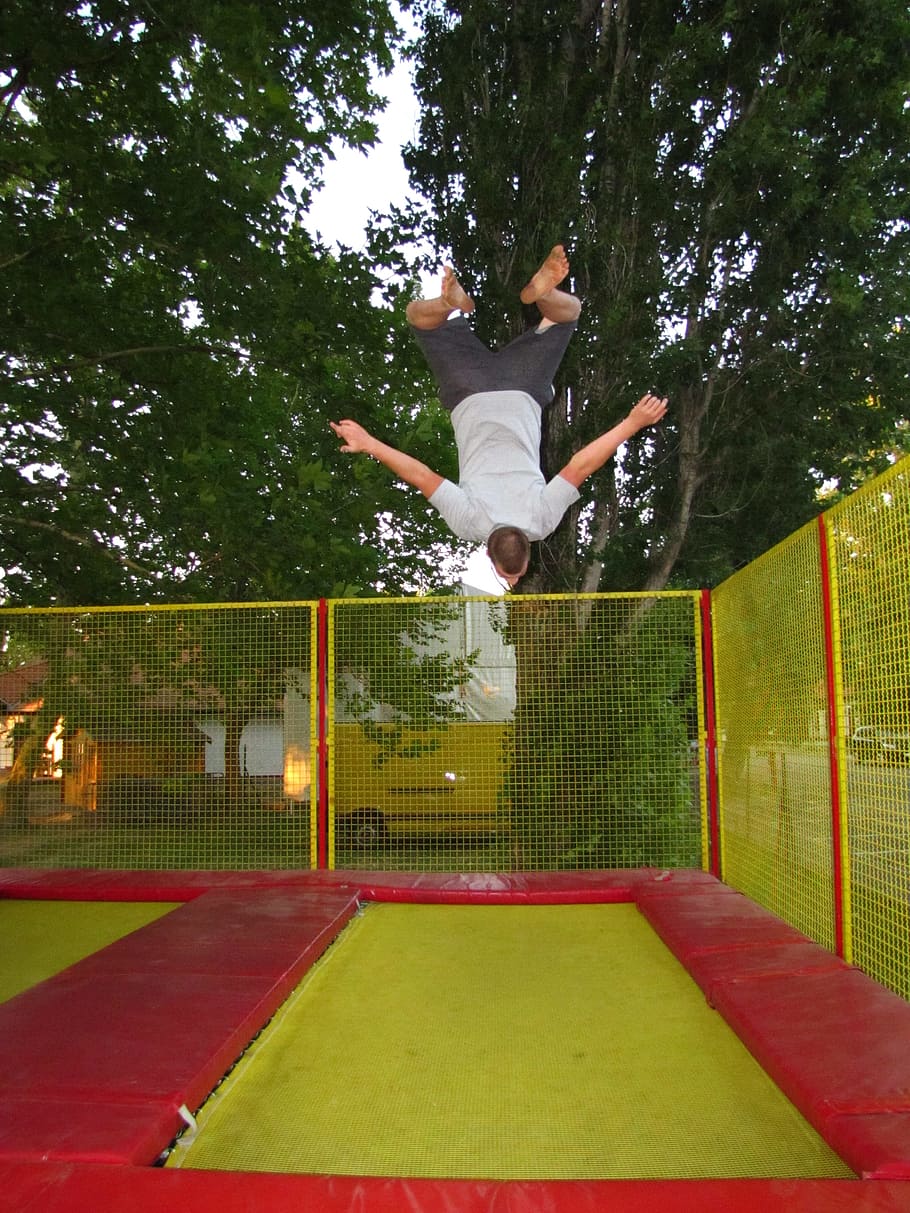 HD Wallpaper Man Jumping On Green And Red Trampoline Sports