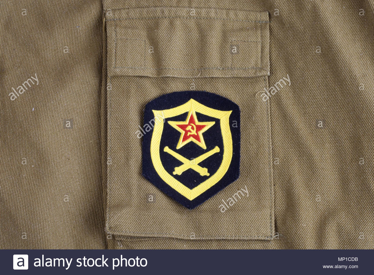Soviet Army Artillery Shoulder Patch On Khaki Uniform Background